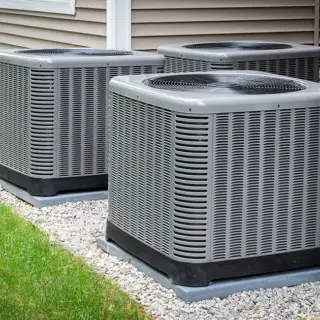 Outdoor HVAC units cooling a home