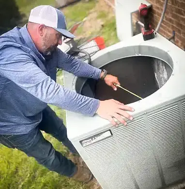 Cleaning out a customer's AC condenser