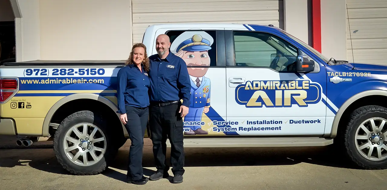 The owner of Admirable Air standing in front of a service truck.